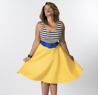 a woman in a yellow skirt posing for a photo